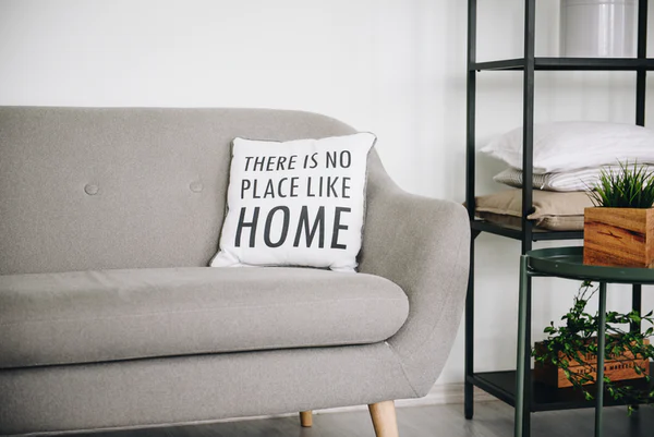 Couch in foster home with home sweet home pillow