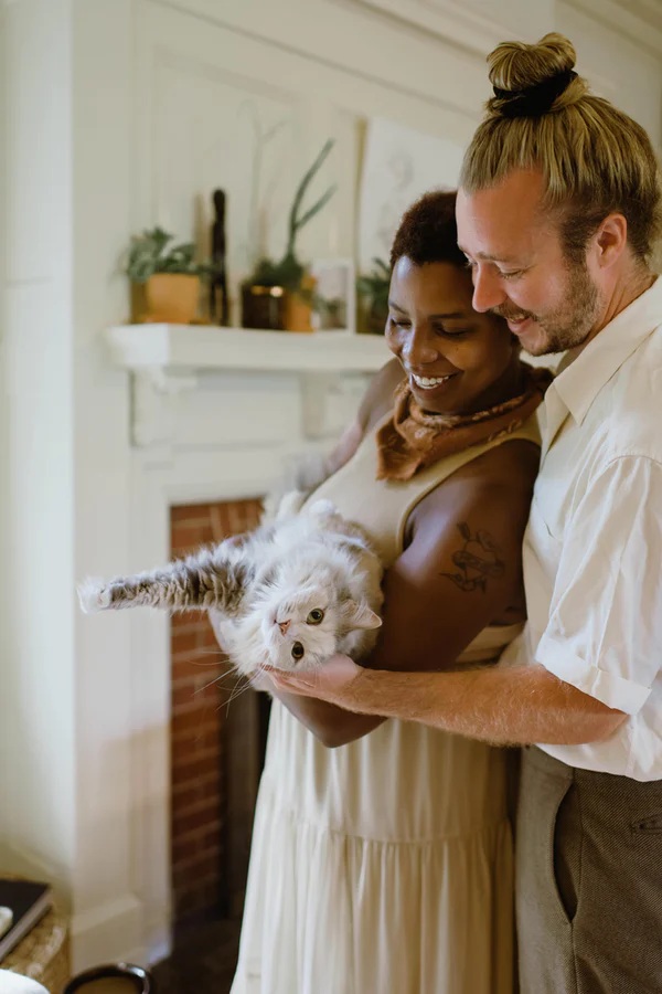 Family wishing to become foster home. Husband and wife with cat and opening their home to children in need.